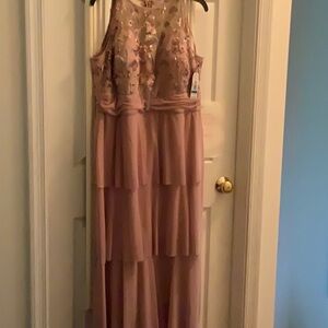 Women’s beautiful long tiered dress. New with tag. Never worn.